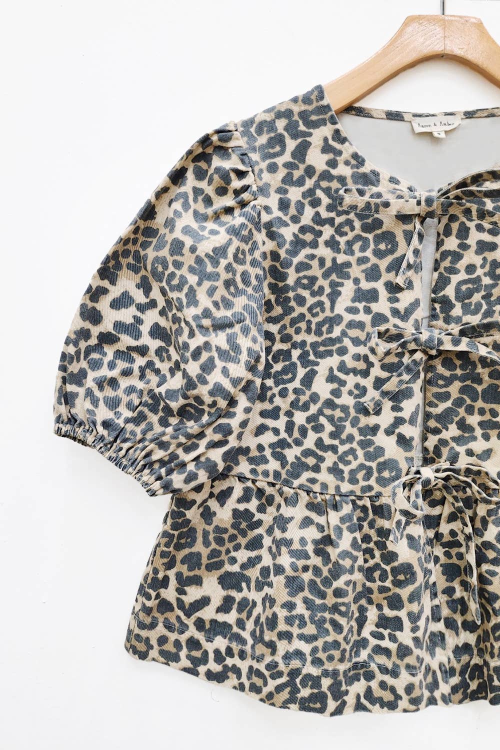 MAT2803-ANIMAL ANIMAL PRINT FRONT BOW TIE PEPLUM BLOUSE
